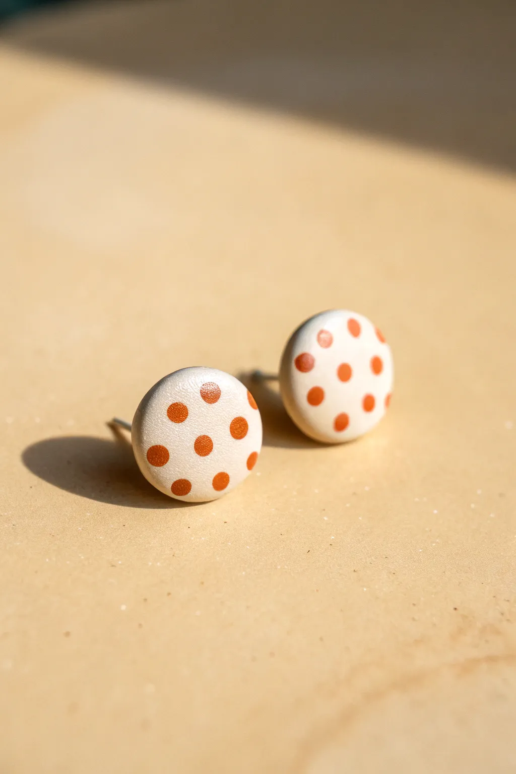 Beginner-friendly polka-dot polymer clay studs with clean contrast and minimalist charm