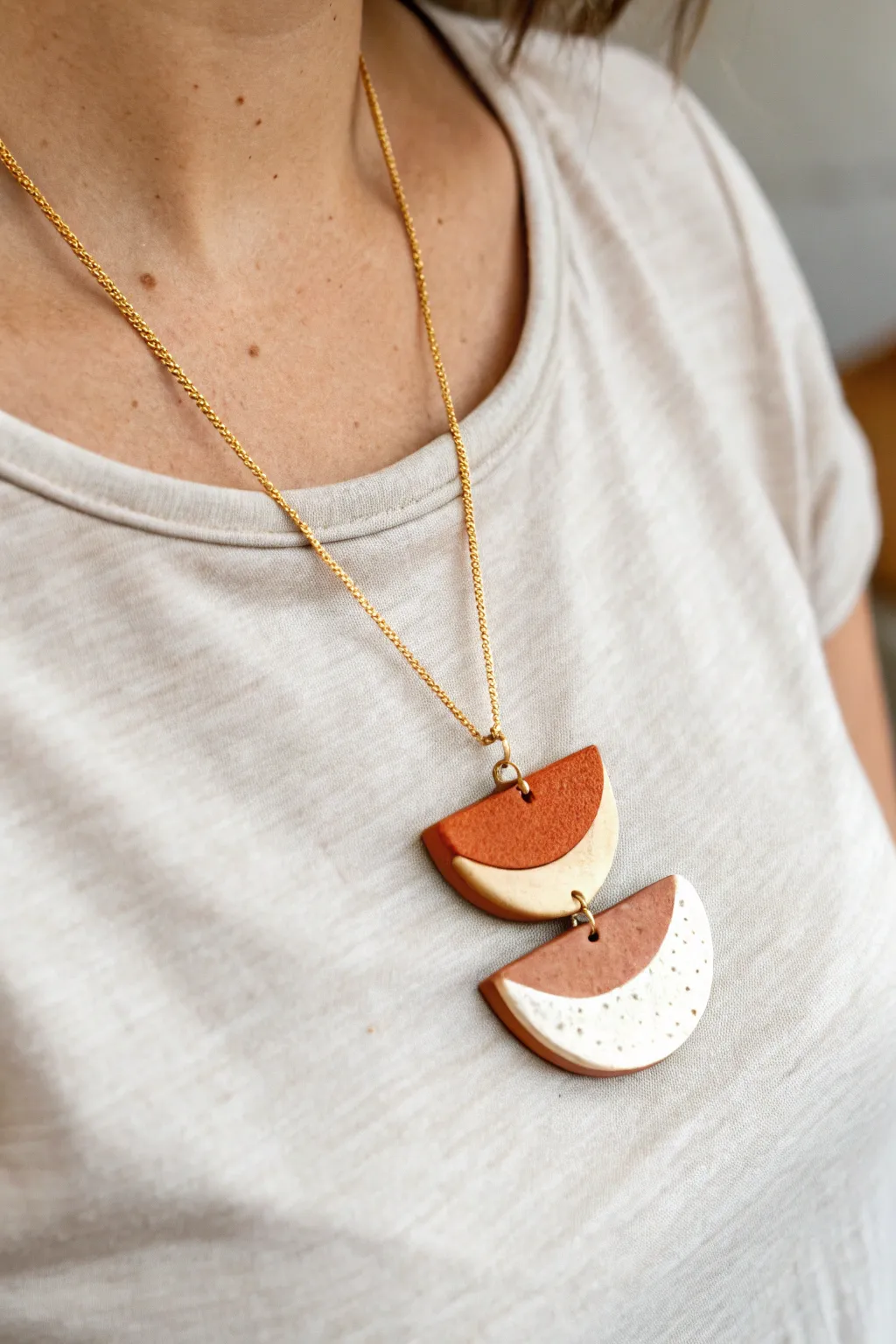 Layered polymer clay pendant necklace in earthy tones, minimalist boho style for DIY inspiration