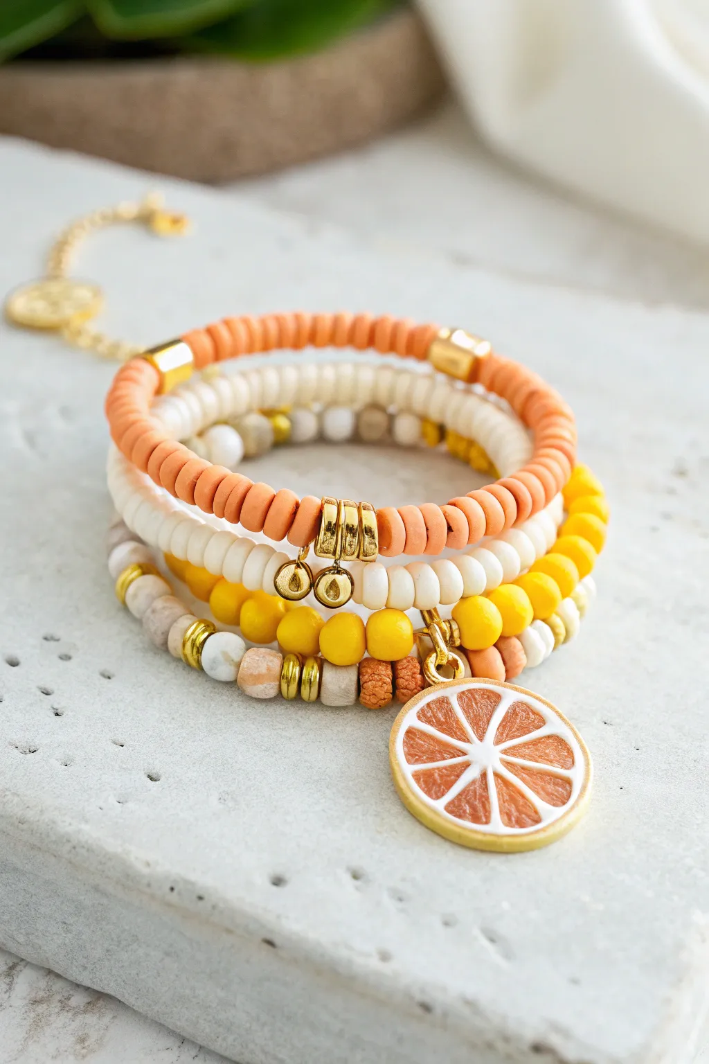 Citrus slice summer stack with orange, yellow, and white heishi beads for a fresh preppy vibe