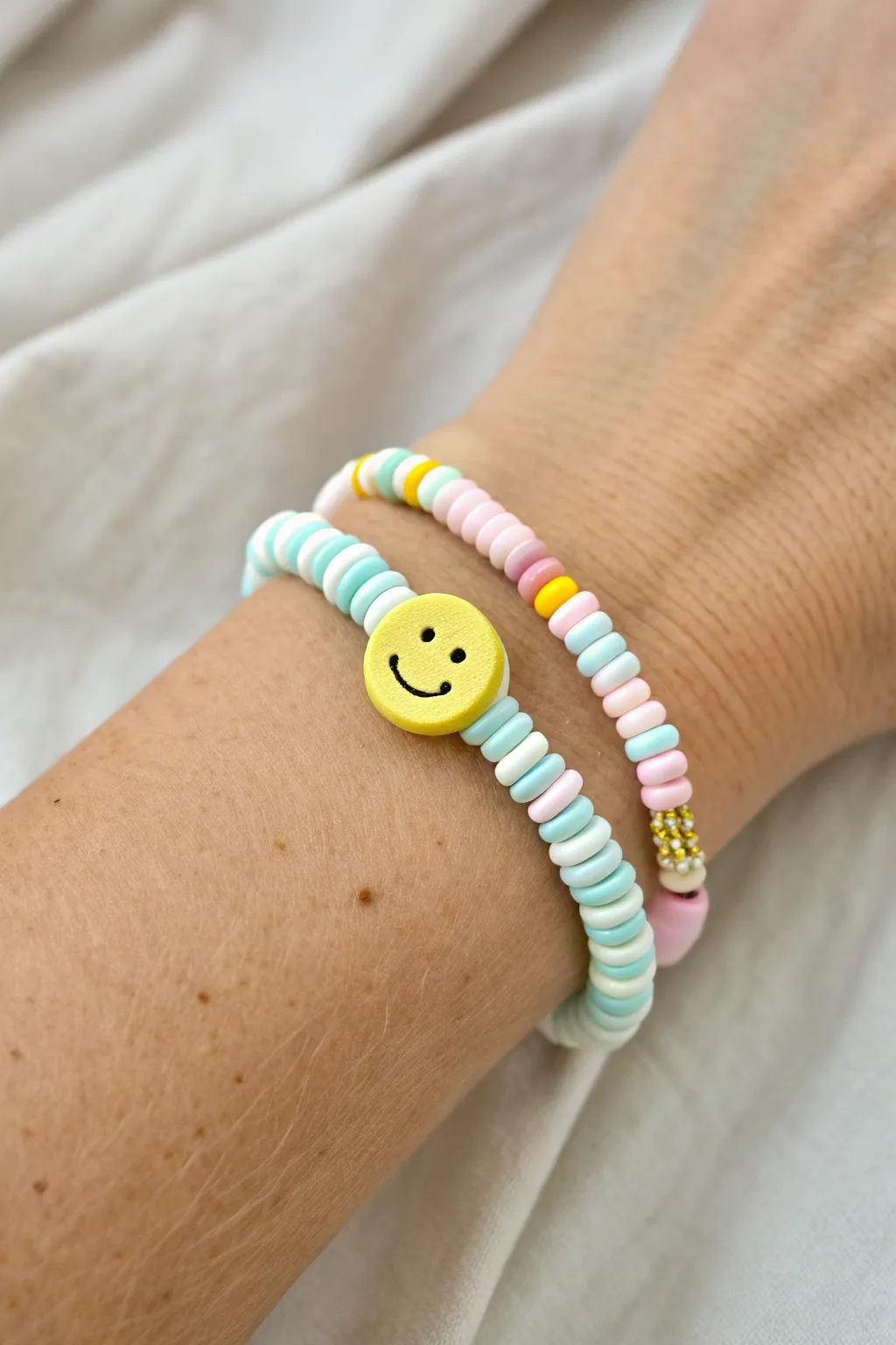 Preppy heishi smiley bracelet with pastel stack vibes, clean Scandinavian styling and boho charm