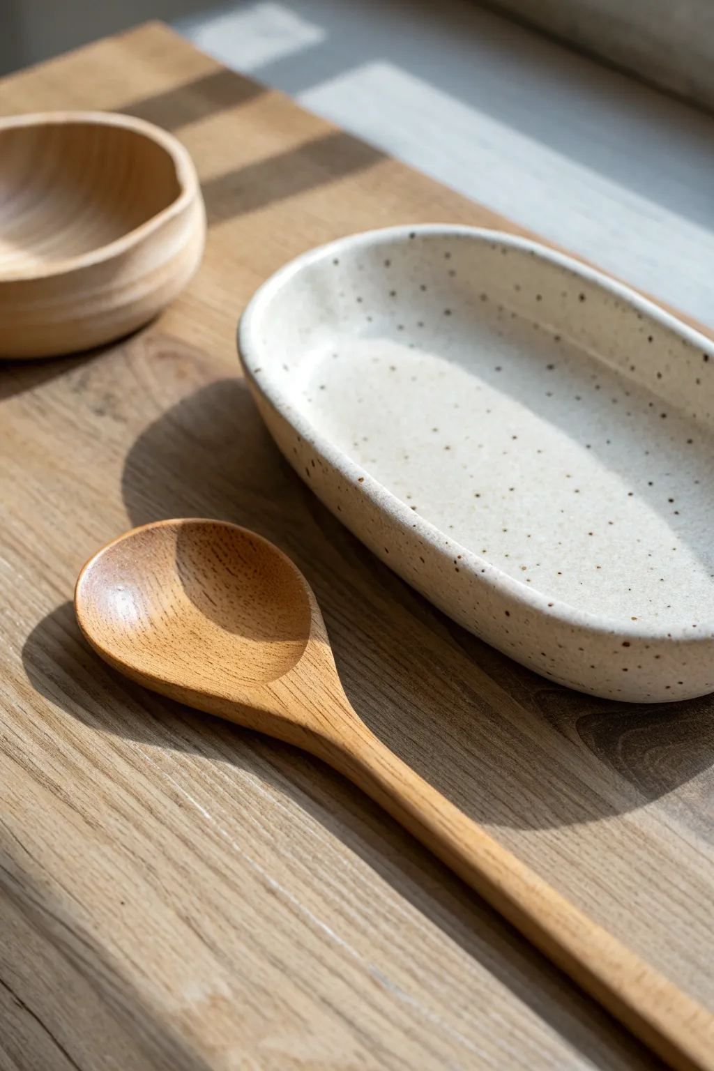 Beginner-friendly slab spoon rest with a simple notch, styled in warm minimalist kitchen tones