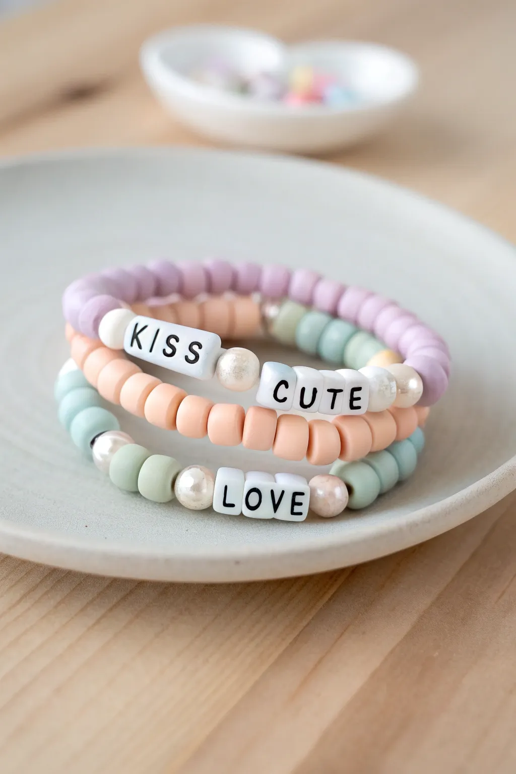 Candy pastel clay bead bracelet stack with sweet Valentines word beads in a minimalist boho style
