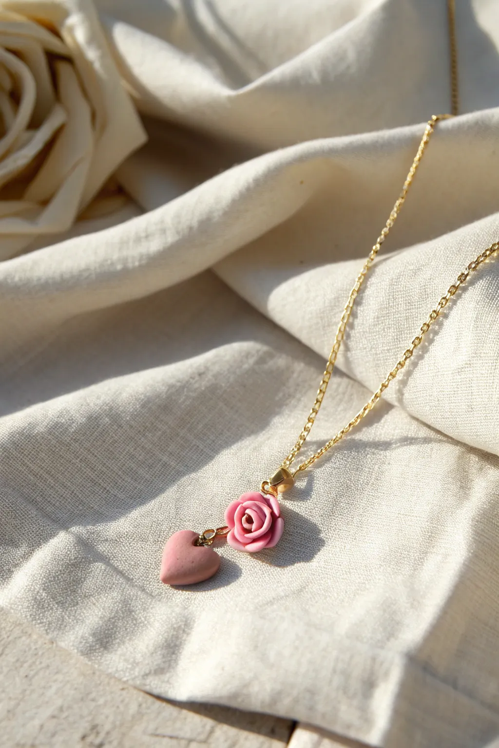 Sweet rosebud clay charm necklace with a tiny heart accent for a minimalist Valentine look