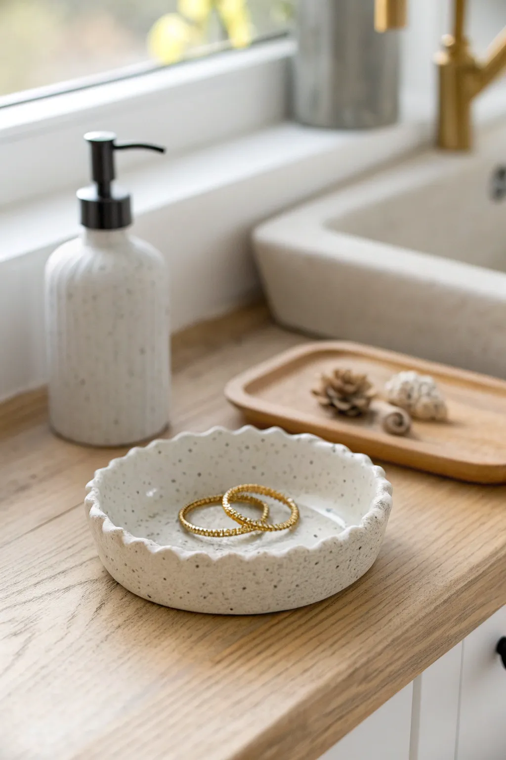A simple air dry clay ring dish keeps your rings safe and stylish right by the sink.