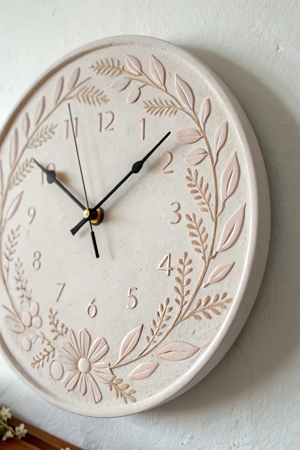 Minimal sgraffito floral wreath ceramic clock in soft neutrals, handmade Scandinavian boho charm