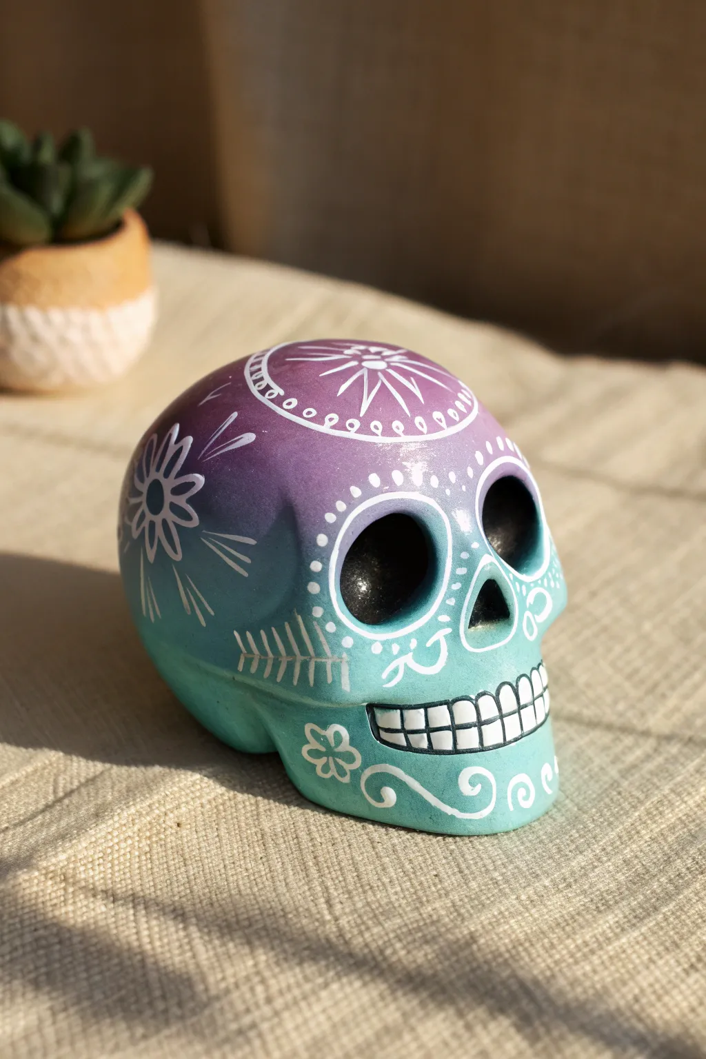 Teal-to-purple ombre sugar skull with crisp white linework for a modern boho vibe.