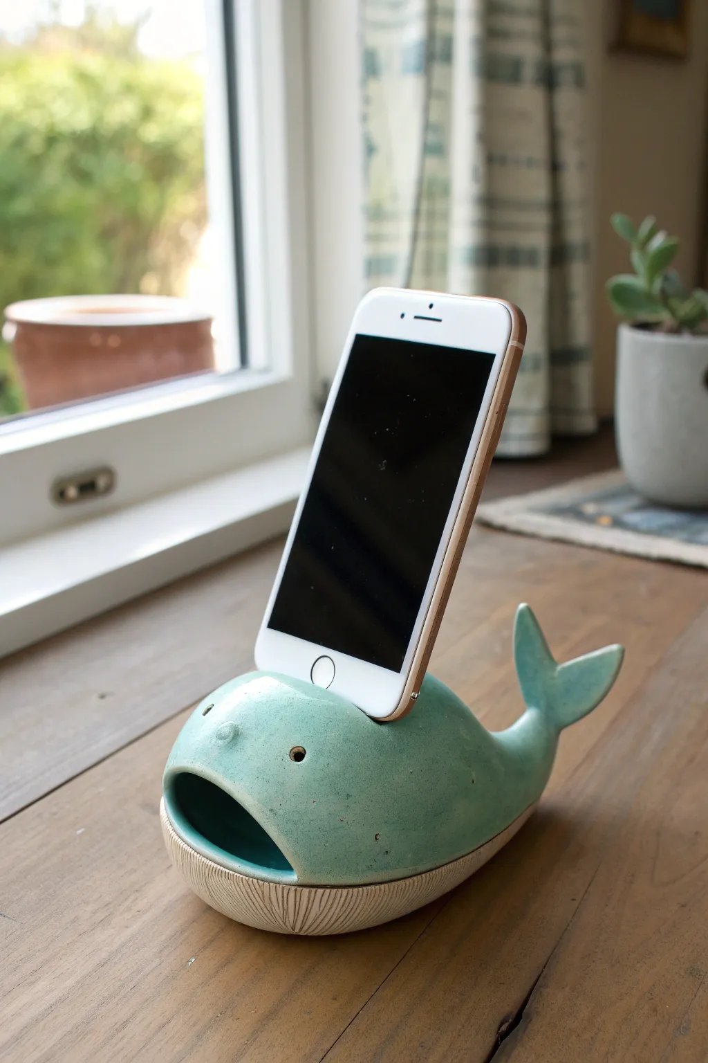 Whale spout horn clay amplifier in ocean glaze, simple and serene, made for cozy sound.