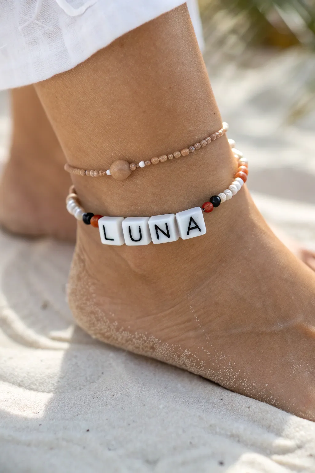 Minimal clay heishi anklet with letter beads, a sweet personalized touch in soft neutral tones