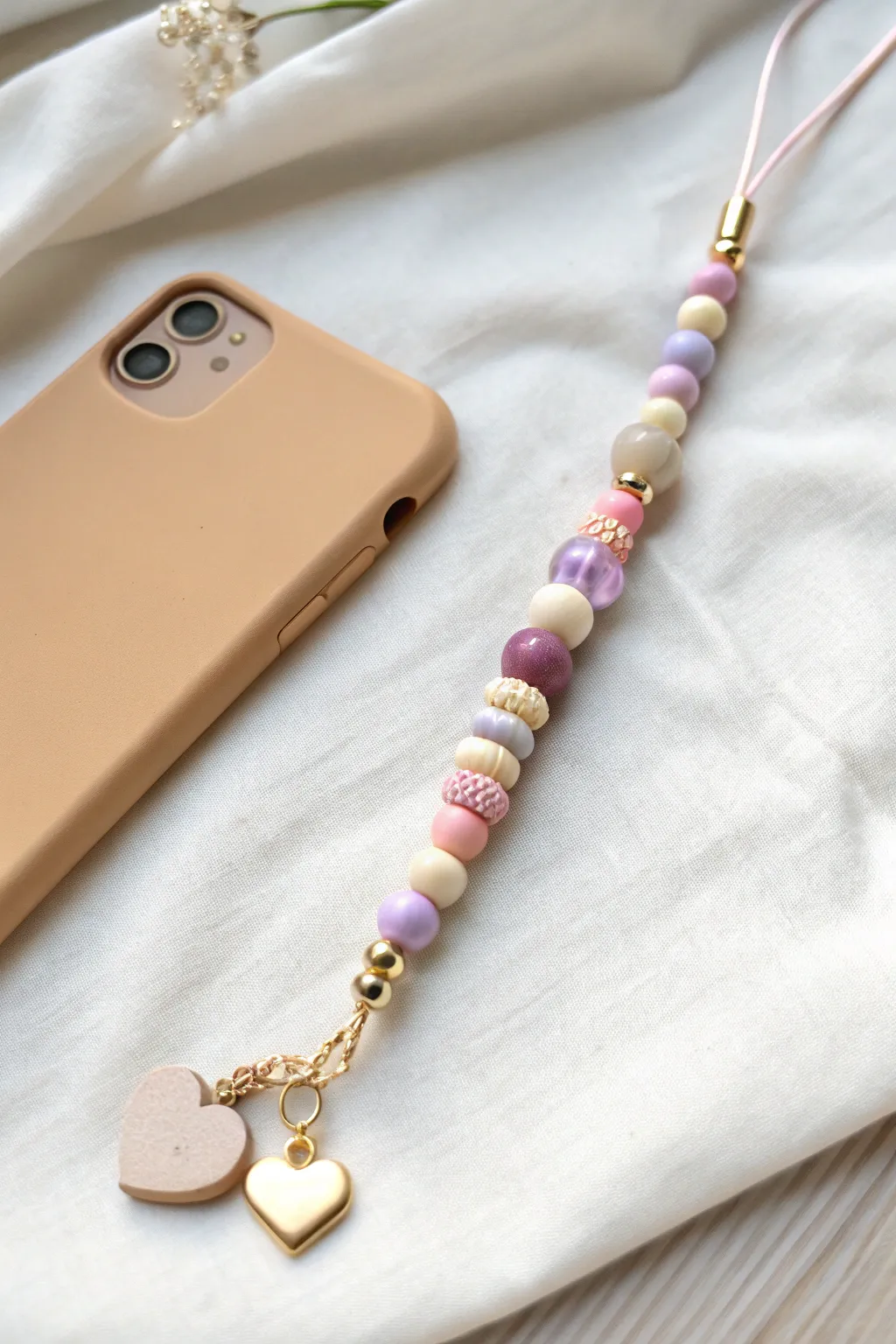 Sweet heart charm drop in pastel clay beads, a minimal boho phone charm that feels handmade and soft.