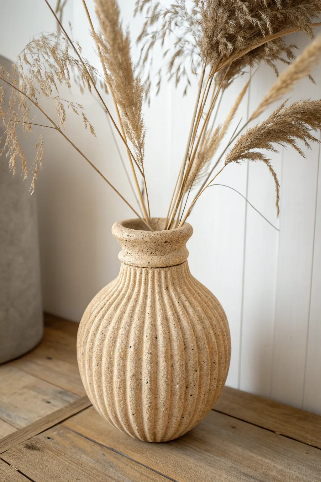 Corrugated pinched-coil vase with rugged texture, styled simply with dried grasses.