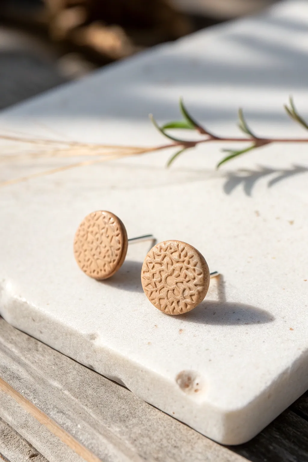 Simple stamp-texture clay studs in a warm neutral tone, minimalist and beginner friendly