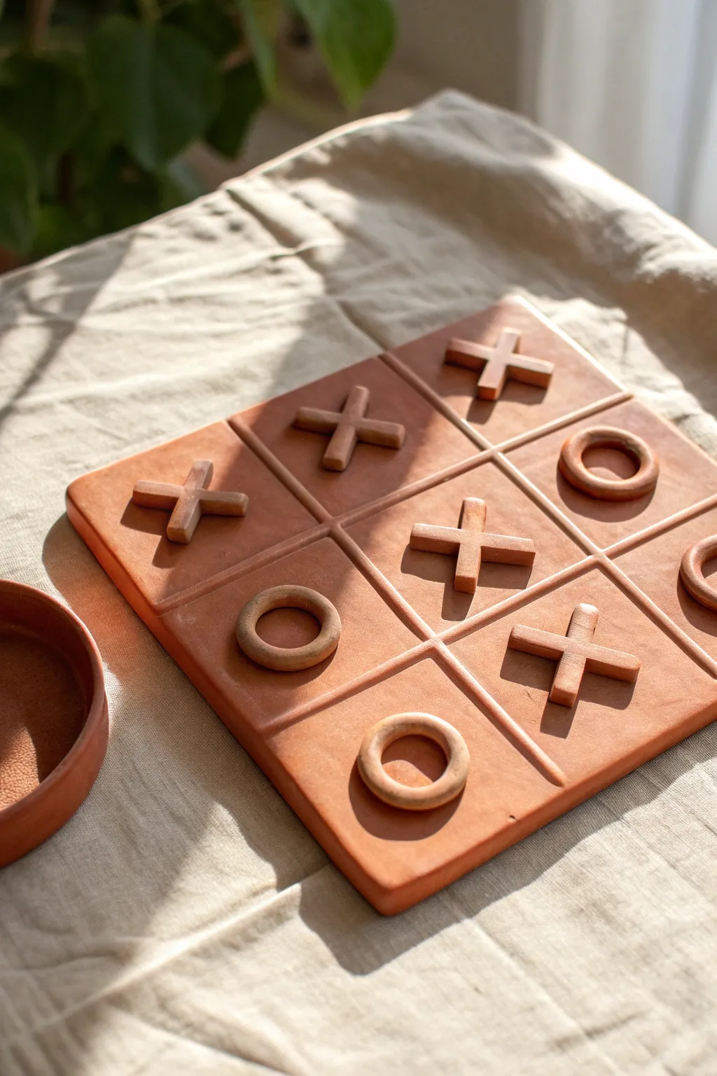 Minimalist clay tic-tac-toe set, a perfect middle school project that looks beautifully handmade.