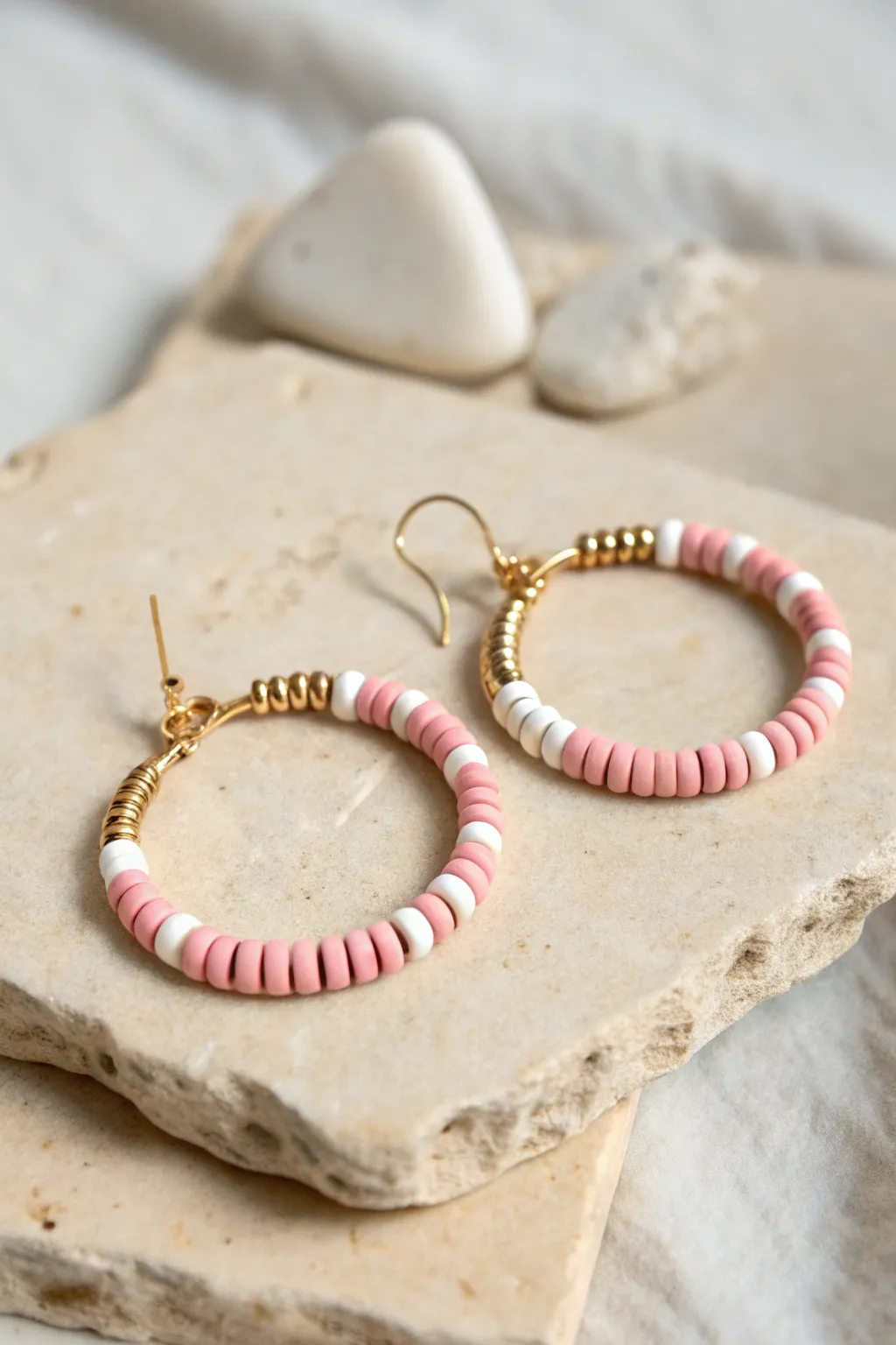 Sweet candy stripe heishi hoop earring in blush and white, minimalist boho charm.