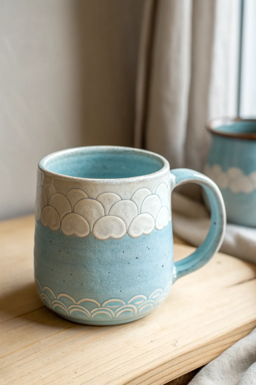 Sky-blue cloud mug with puffy 3D edges, a cozy handmade look with clean minimalist charm