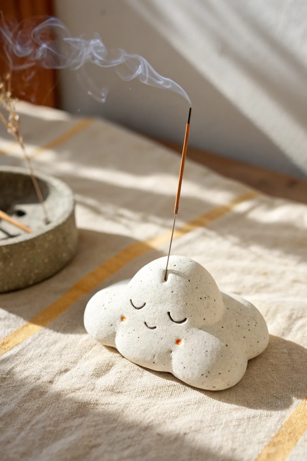 A dreamy cloud-shaped clay incense holder that adds calm, cozy minimalism to your space.
