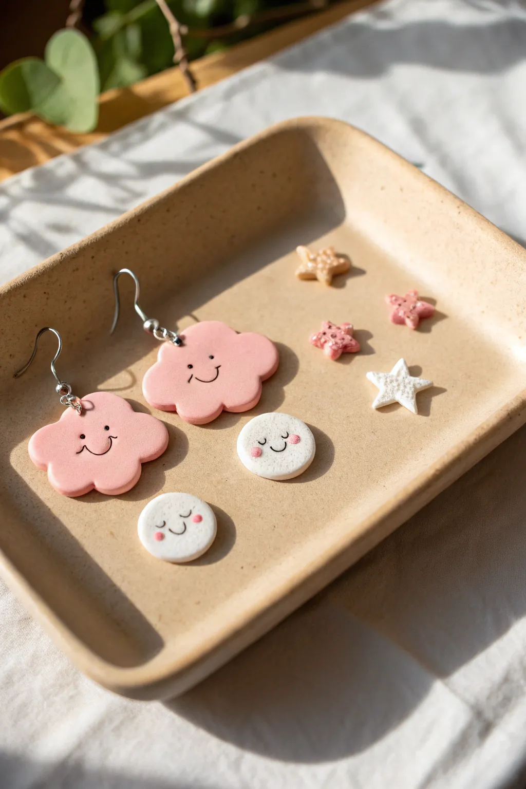 Cute pink cloud and star clay earrings set in a clean Scandinavian flat lay, soft boho vibes.