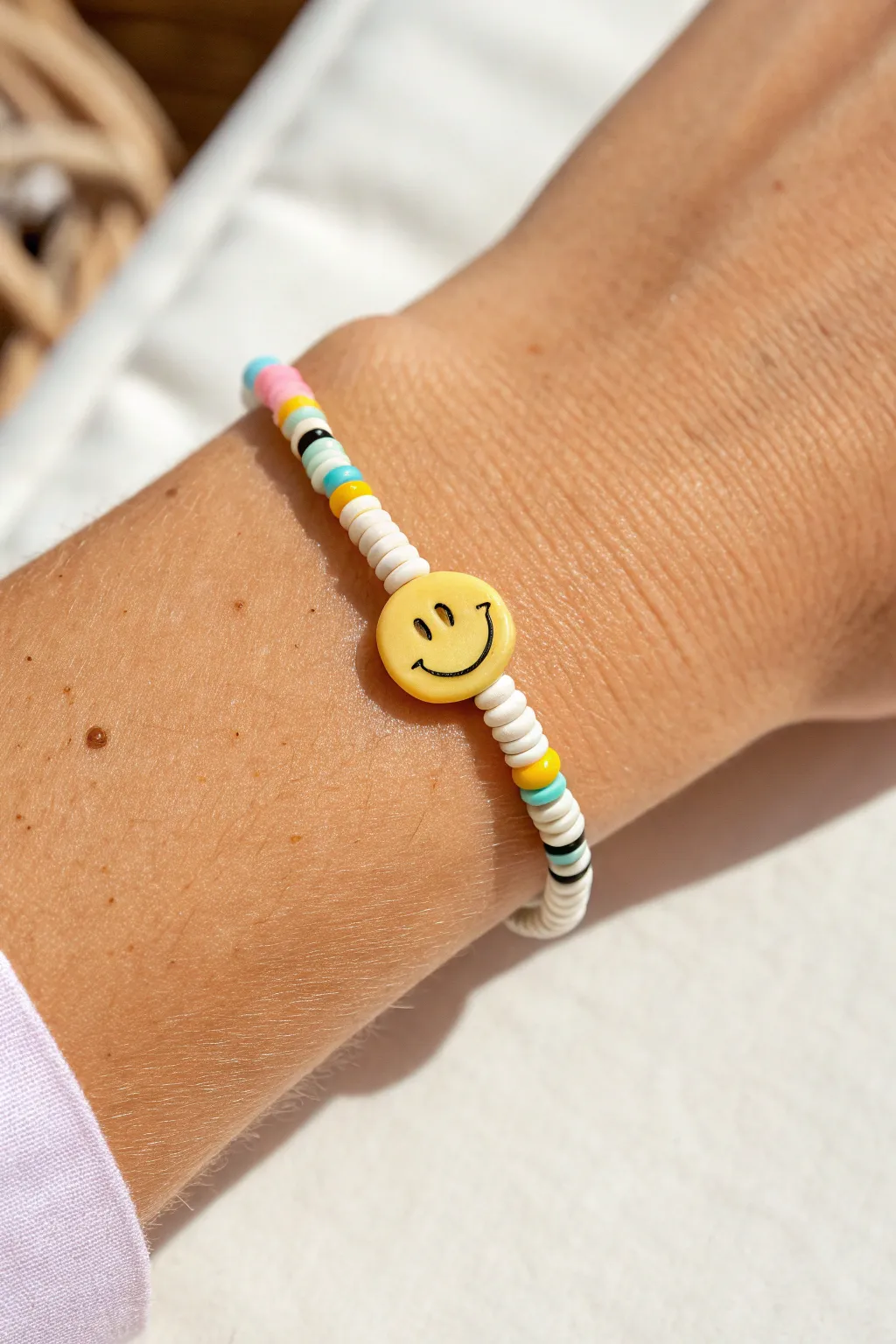Cheerful smiley focal bead with bright polymer clay heishi beads, stacked for an easy look
