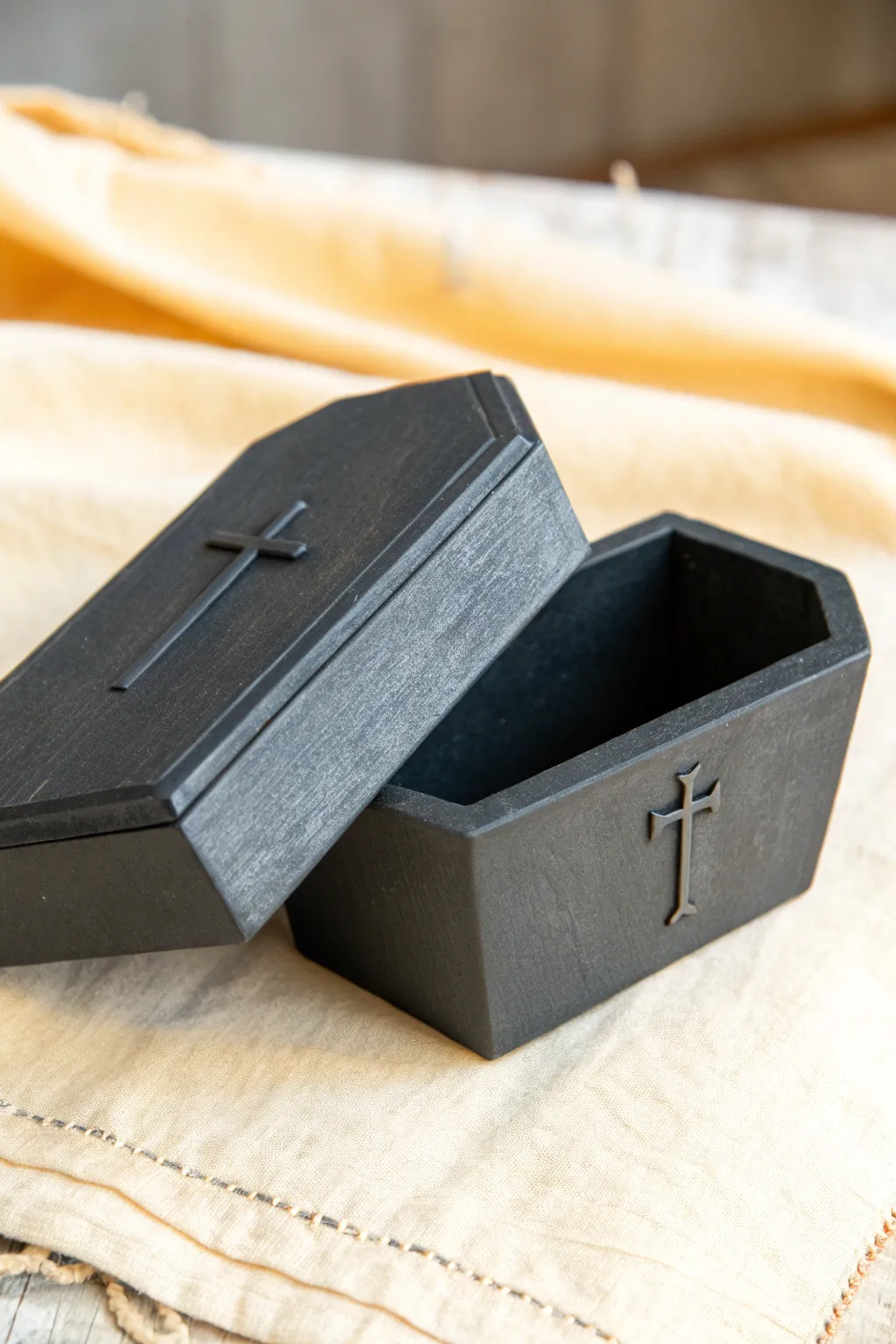 Mini coffin trinket box in matte clay, simple and chic Halloween storage with minimalist charm.