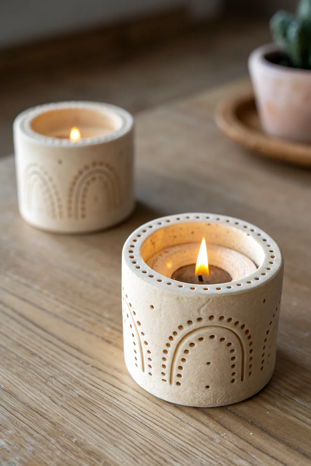 Cozy mini clay date: matching carved candle holders for a simple, romantic finish.