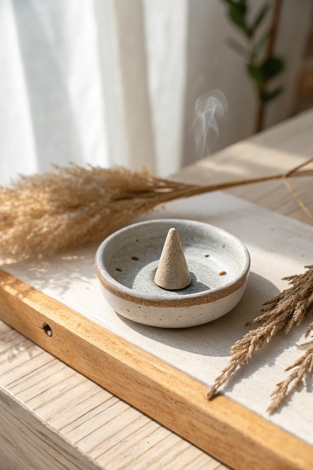 Tiny handmade incense cone dish, minimalist clay beauty for calm, scented moments.