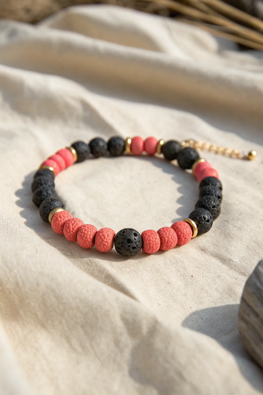 Beachy polymer clay bracelet with faux coral texture and matte lava beads in minimalist style
