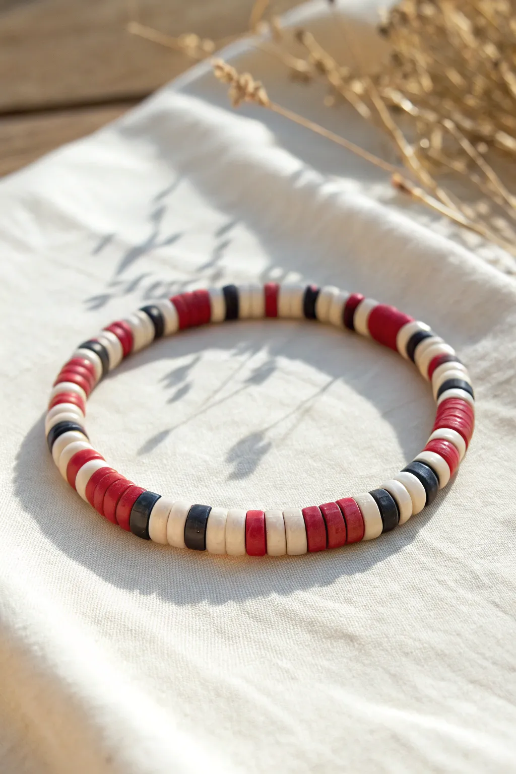 Two-color heishi checkerboard bracelet with bold contrast, styled in a clean Nordic boho look.