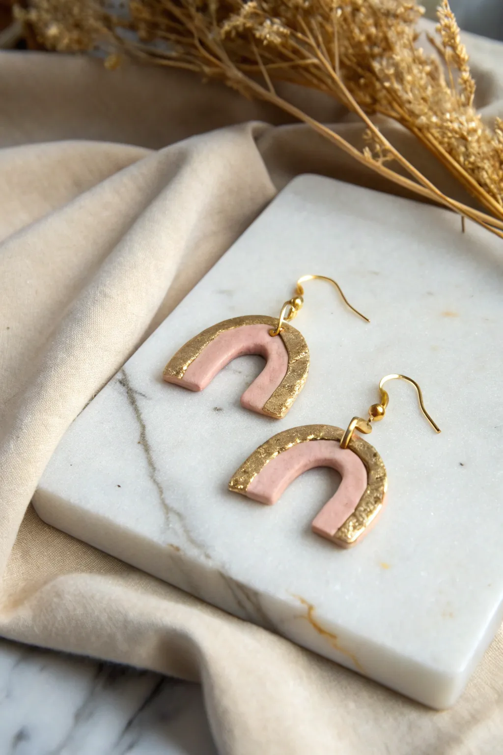 Minimal polymer clay earring with gold leaf edge, Scandinavian calm with a soft boho glow.