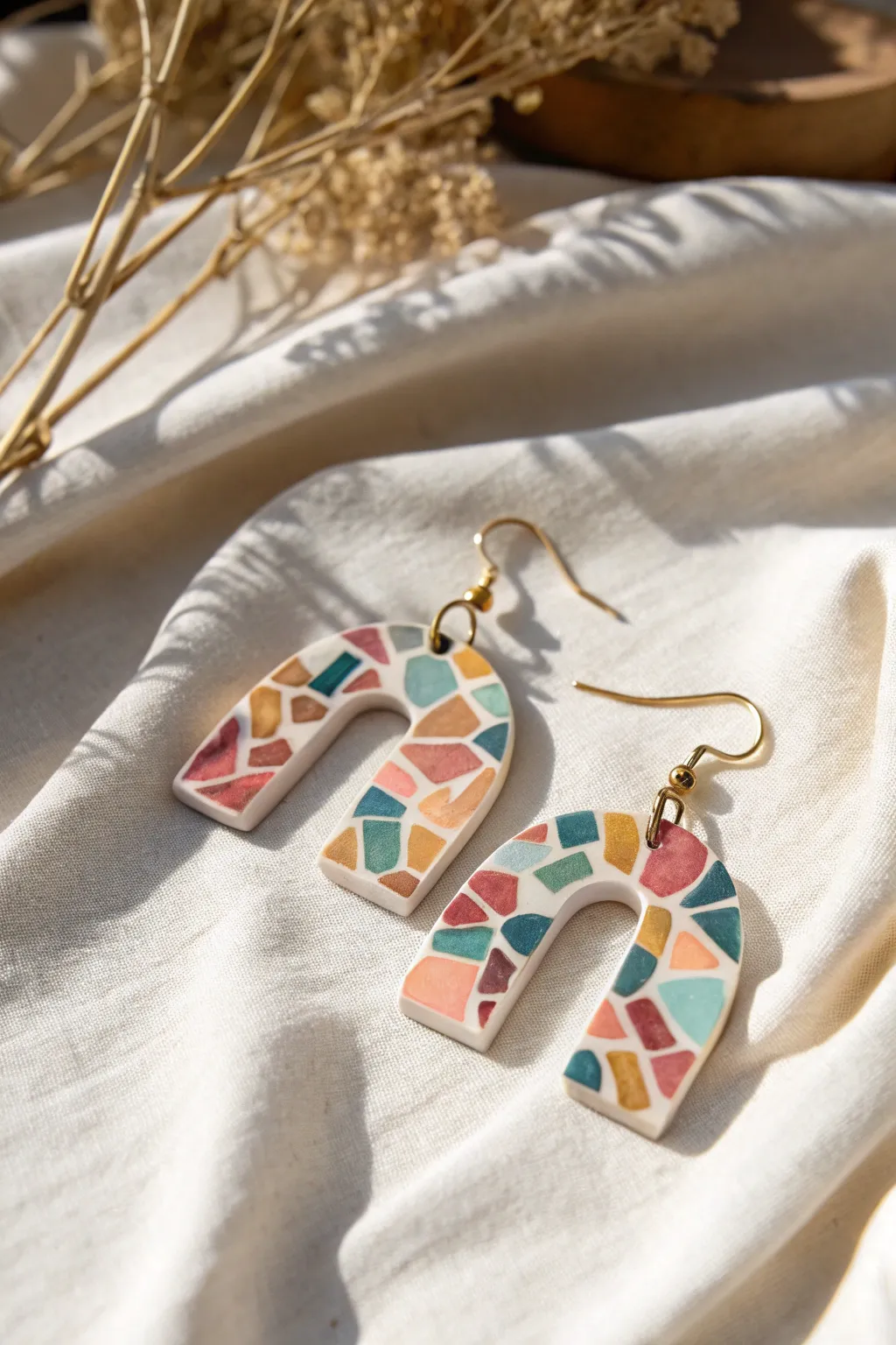 Cane-slice mosaic slab earring close-up with tiny patterns, minimalist boho palette, matte finish.