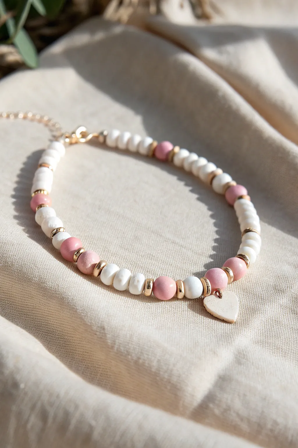 White and blush clay discs with tiny heart accents for a sweet, preppy minimalist bracelet.