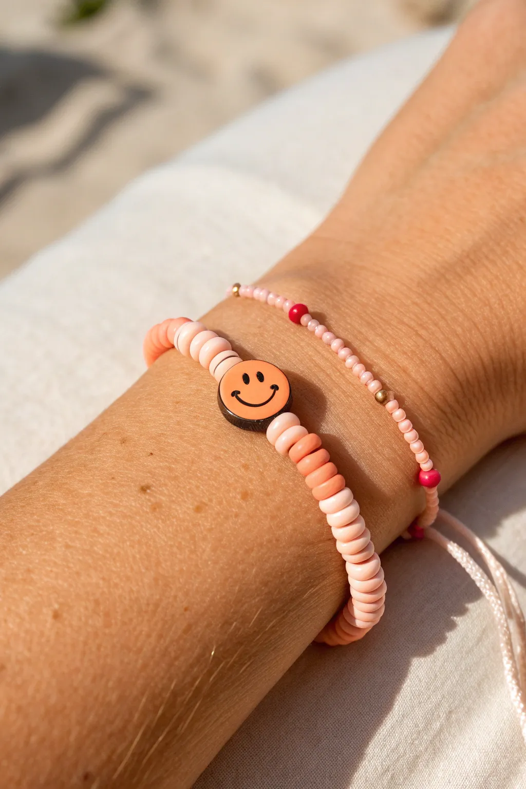 Minimal heishi bracelet with one smiley focal bead for an easy, happy clay bead accent.