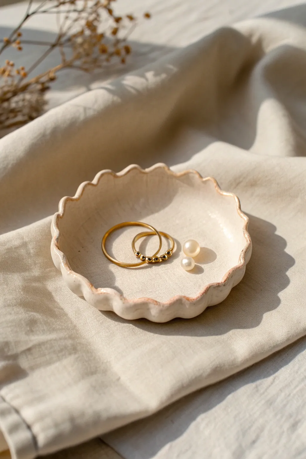 Soft clay scalloped trinket dish in minimal Nordic style, perfect for rings and beads.