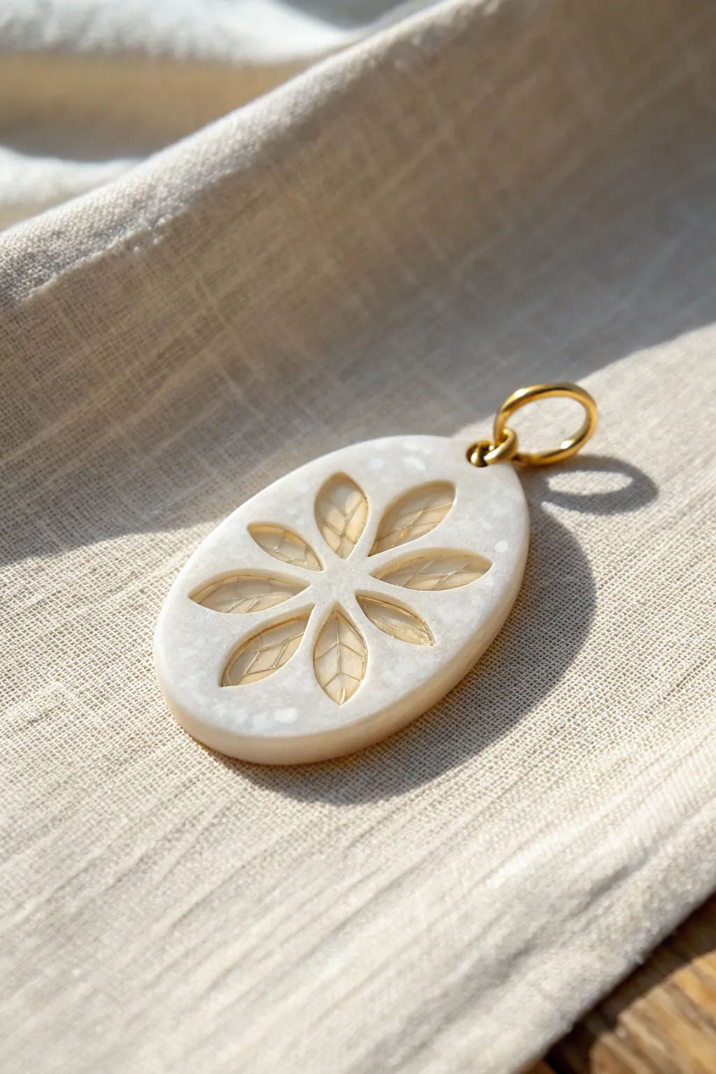 Backlit translucent cane slices create a floating window effect inside a simple pendant charm.
